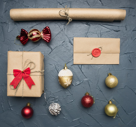 Christmas flat lay gift in packing, paper, envelope with print, Christmas tree toysの写真素材