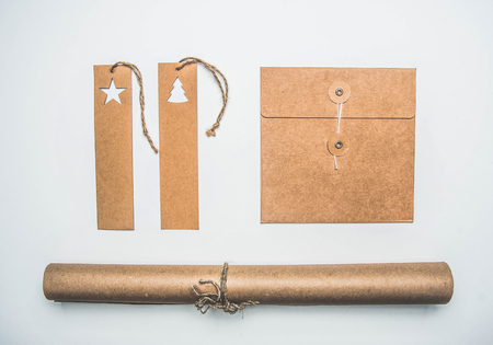 Christmas concept, wrapping paper, envelope and tags on white background flat layの写真素材