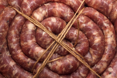 Ring of tyied home-made sausage closeup photoの写真素材