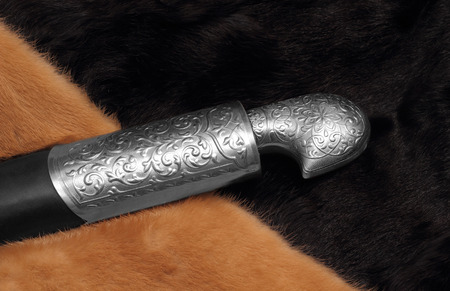 Circassian cavalry sword hilt  in a sheath closeup photoの写真素材