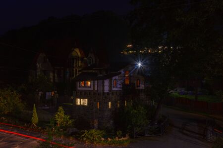 Residential private house in a mountain village at nightの写真素材