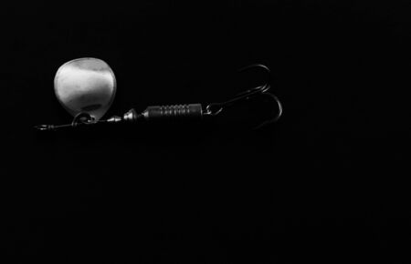 An exhibition of pirated copies of fishing metal spoon baits. Bait for fishing in the shape of a...
