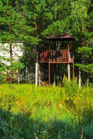 The abandoned building of the guard tower for soldiers. Dead military unit. Consequences of the Chernobyl nuclear disaster, August 2017.の写真素材