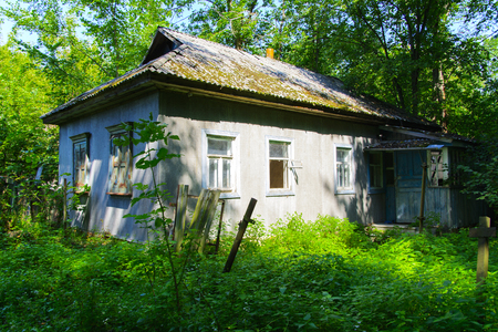 Destroyed houses in which people lived in a dead radioactive zone. Consequences of the Chernobyl nuclear disaster and vandalism, August 2017.の写真素材
