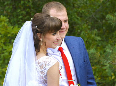 Beautiful and happy young bride and groom in wedding dress on a sunny day. Ukrainian wedding, culture, ethical traditions, concept. Autumn of 2017.のeditorial素材