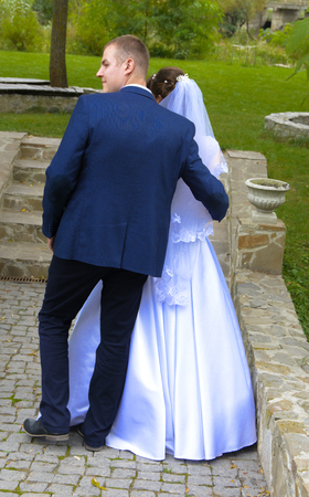 Beautiful and happy young bride and groom in wedding dress on a sunny day. Ukrainian wedding, culture, ethical traditions, concept. Autumn of 2017.のeditorial素材