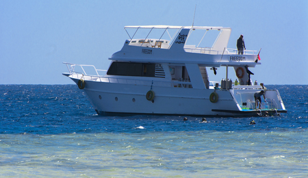 Sharm el-Sheikh, Egypt - March 14, 2018. Luxurious snow-white motor yacht in the Red Sea against the...