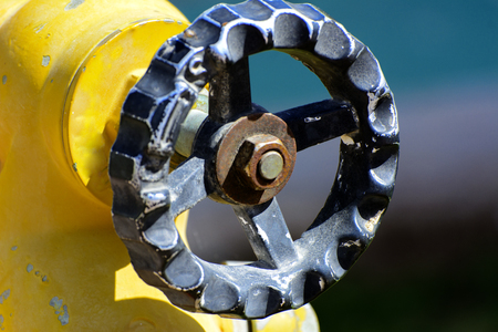 Yellow fire hydrant connections. Fire hydrant or fire pump, represents the point of connection, through which firefighters can enter the water supply. Active fire protection component.の写真素材