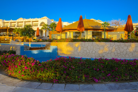 Sharm el-Sheikh, Egypt - March 14, 2018. The courtyards of a magnificent white hotel in the morning. Sunrise. The concept tourism, vacations and luxury recreation. Accommodation in Cyrene Grand Hotelのeditorial素材