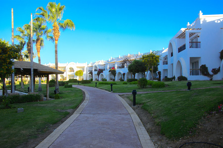 Sharm el-Sheikh, Egypt - March 14, 2018. The courtyards of a magnificent white hotel in the morning. Sunrise. The concept tourism, vacations and luxury recreation. Accommodation in Cyrene Grand Hotelのeditorial素材