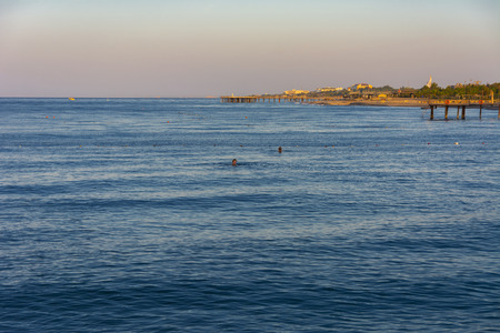 Alanya, Turkey - October 05, 2018. Beautiful hotels against the background of distant mountains and blue sky. Photos of the coast in the early morning. The concept of summer holidays, sports, tourismのeditorial素材