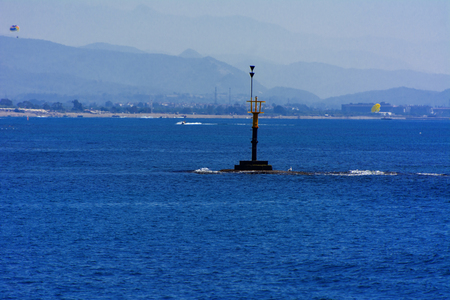 Alanya, Turkey - October 05, 2018. Beautiful hotels of Turkey against the background of distant mountains and blue sky. Photos of coast from the sea. The concept of summer holidays, sports, tourismのeditorial素材