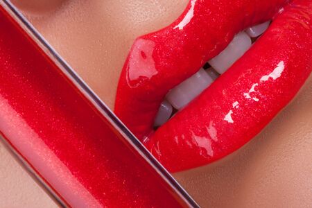 Red gloss lips. Beautiful red lips close-up.の写真素材