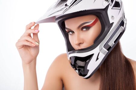 Beautiful girl with makeup in a helmet.の写真素材