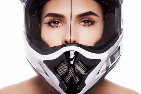 Beautiful girl with makeup in a helmet.の写真素材