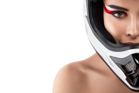 Beautiful girl with makeup in a helmet.の写真素材