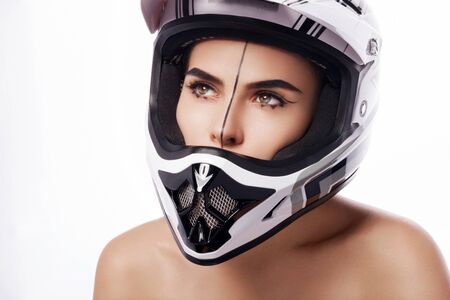 Beautiful girl with makeup in a helmet.の写真素材