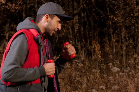 Man in sportswear relaxing in the forest.の写真素材