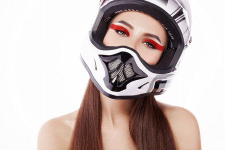 Beautiful girl with makeup in a helmet.の写真素材