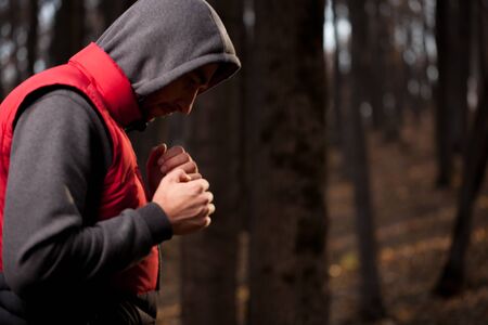 Man in sportswear relaxing in the forest.の写真素材