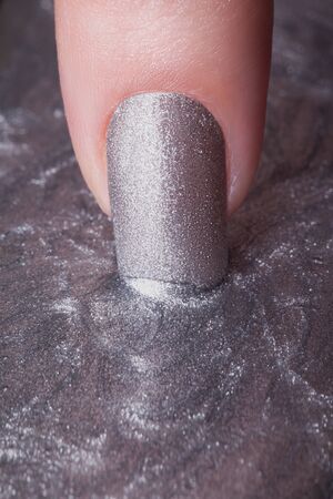 Very beautiful silver metallic nails closeup.の写真素材