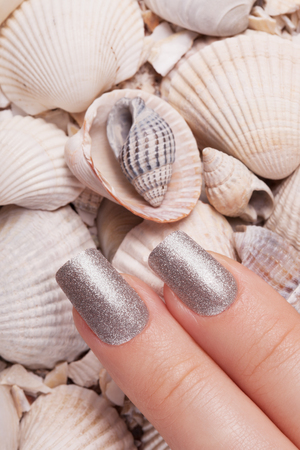 Very beautiful silver metallic nails closeup.の写真素材