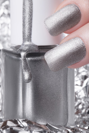 Very beautiful silver metallic nails closeup.の写真素材