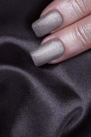 Very beautiful silver metallic nails closeup.の写真素材