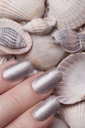 Very beautiful silver metallic nails closeup.の写真素材