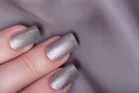 Very beautiful silver metallic nails closeup.の写真素材