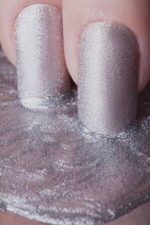 Very beautiful silver metallic nails closeup.の写真素材