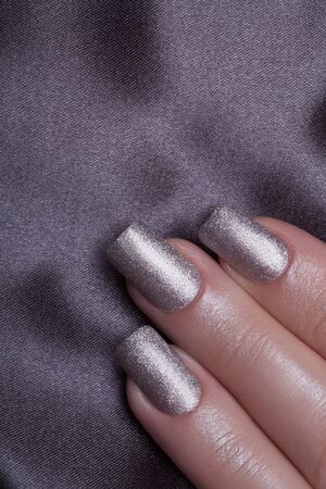 Very beautiful silver metallic nails closeup.の写真素材