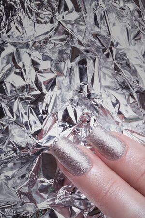 Very beautiful silver metallic nails closeup.の写真素材