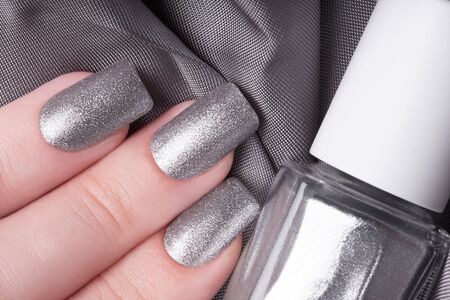 Very beautiful silver metallic nails closeup.の写真素材