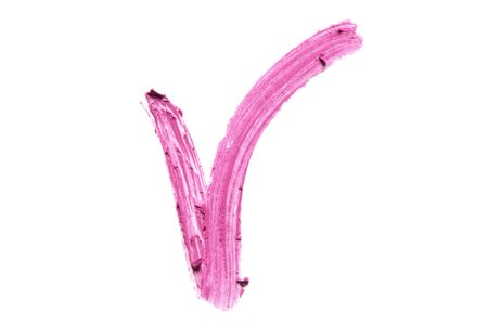 Pink lipstick on a white background close-up.の写真素材
