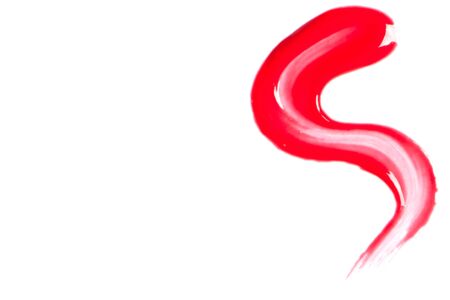 Red lip gloss on a white background close-up.の写真素材
