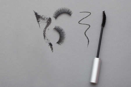 Various cosmetics on a gray background
