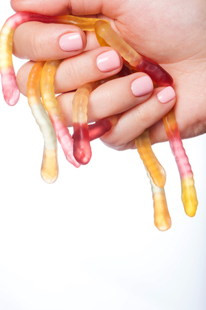 Beautiful pink nails with candy.の写真素材