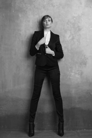 Fashionable girl in a chic classic suit.の写真素材