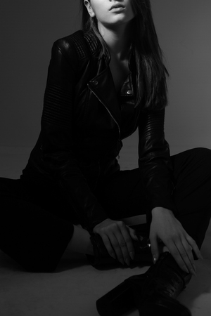 Photo of a girl in fashionable clothes close-upの写真素材