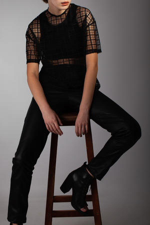 Stylish photo with a smart model in fashionable clothes in the studioの写真素材