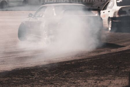 Sports beautiful cars drift on the racetrackの写真素材