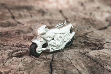 Small toy gray sport bike on nature close-upの写真素材