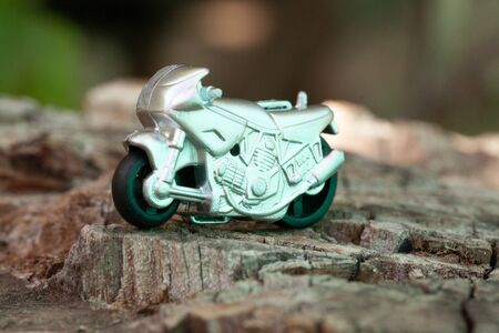 Small toy gray sport bike on nature close-upの写真素材