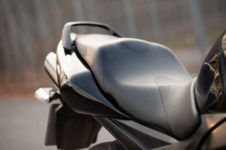 Detail of a black sports motorcycle.