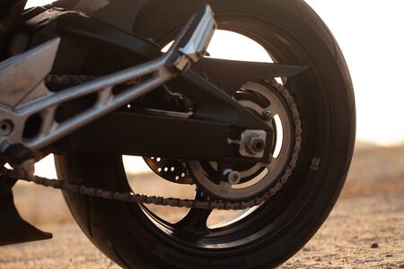 One black motorcycle in the desert in autumn time.の写真素材