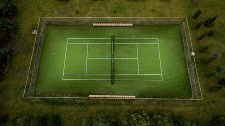 Photo of a tennis green field from a height.の写真素材