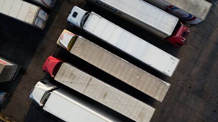 A photo of trucks with a trailer from a height.の写真素材