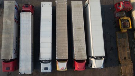 A photo of trucks with a trailer from a height.の写真素材