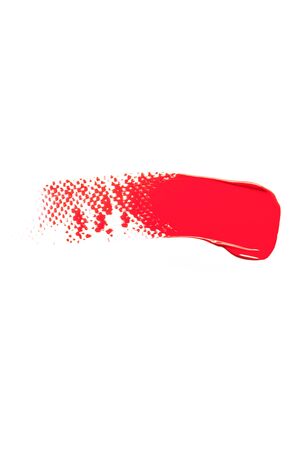 The texture of red lipstick on a white background, close-up.の写真素材